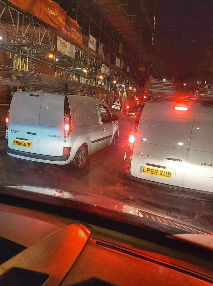 Two vans with the same number plates in London.