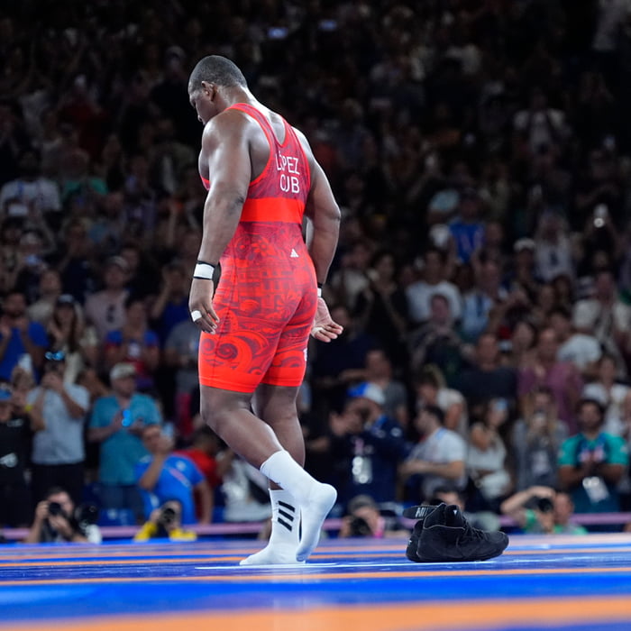 Cuban superheavyweight Greco-Roman wrestler Mijau00edn Lu00f3pez is the first athlete EVER to claim five successive Olympic gold medals in an individual event. He left his shoes in the ring to signal his retirement. F**king legend.